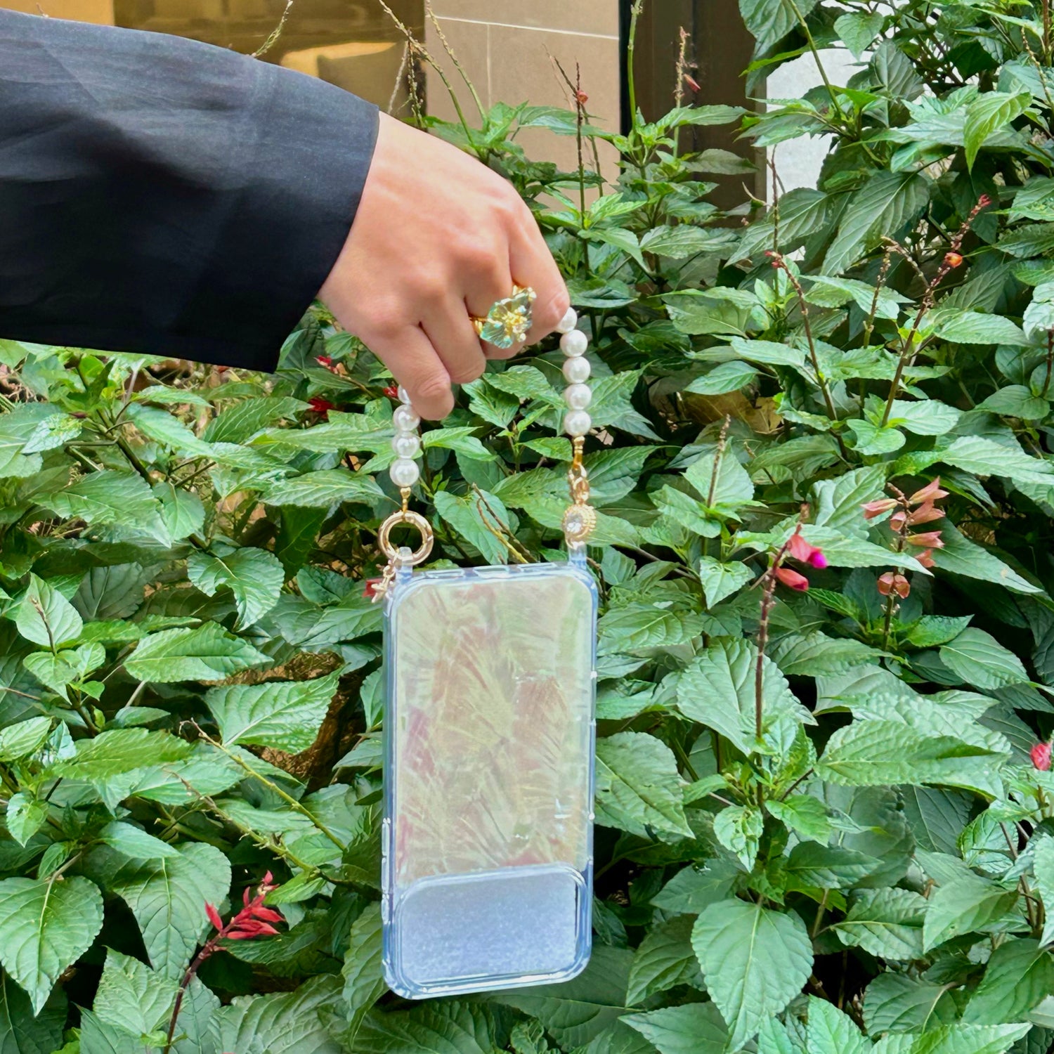 Iridescent Mother-of-Pearl Luxe Phone Case with pearl charm on a white background from London based gemstone jewellery designer WJY studio
